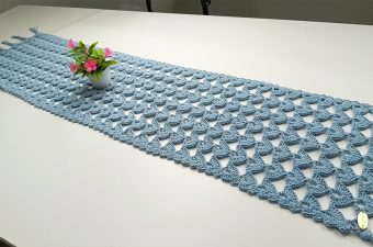 Crochet Easy Table Runner Featured - Crocheting an easy table runner is a delightful way to add a personal touch to your home decor.