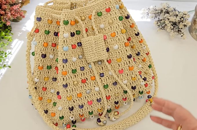 Crochet Beaded Bucket Bag Featured - In the world of crochet, few creations stand out as much as the crochet beaded bucket bag.